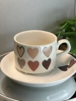 Ceramic cup with saucer